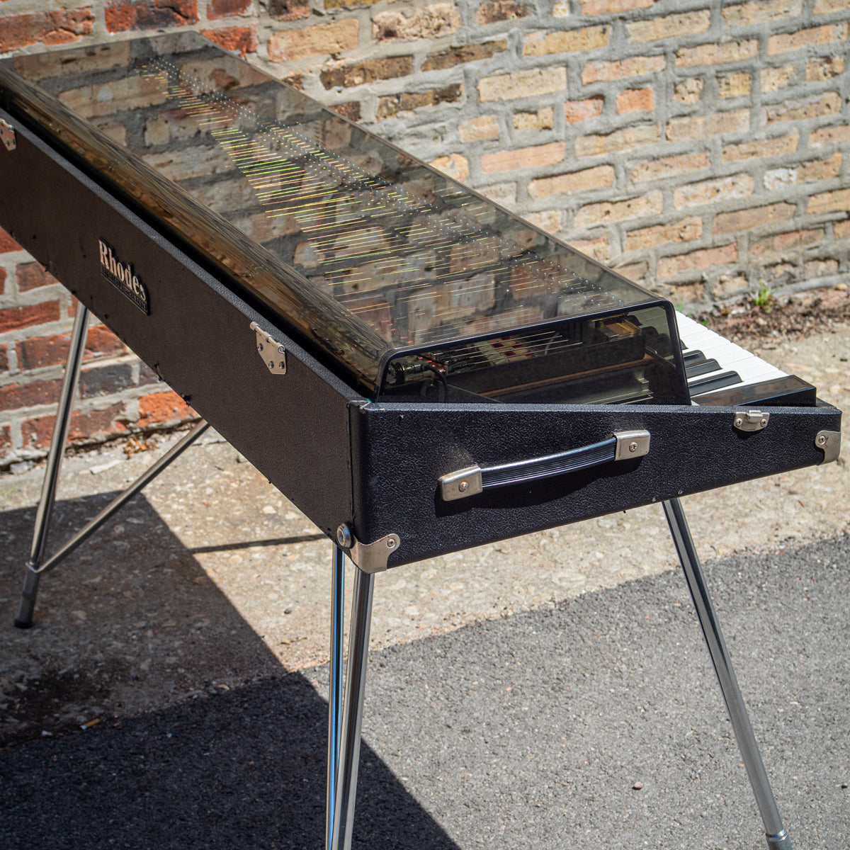 Rhodes Stage piano with a Medium Gray (2064) tinted plexiglass lid